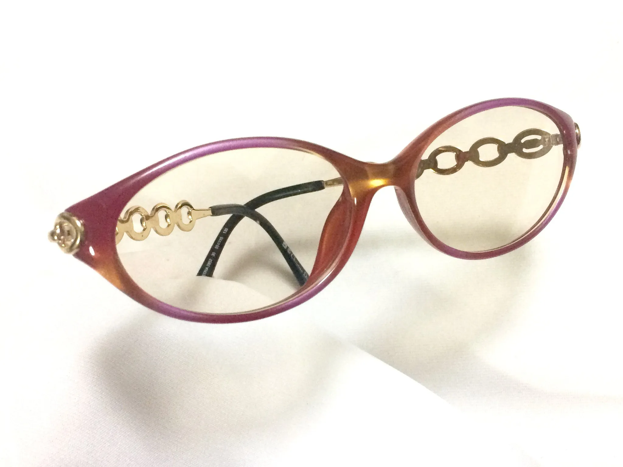 60's, 70's vintage Christian Dior pink and orange gradation sunglasses with golden chain temple. Unique and mod eyewear.