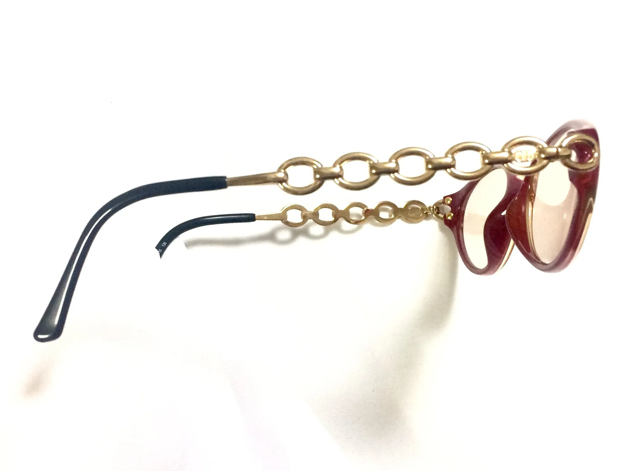 60's, 70's vintage Christian Dior pink and orange gradation sunglasses with golden chain temple. Unique and mod eyewear.