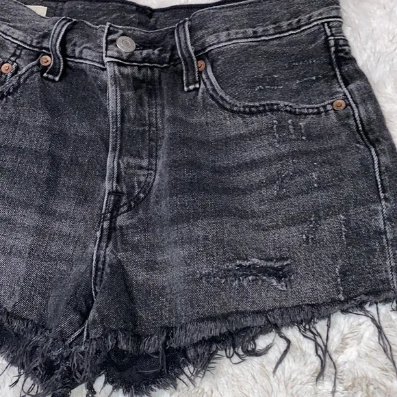 Levi’s 501  distressed black shorts in excellent preowned condition size 27