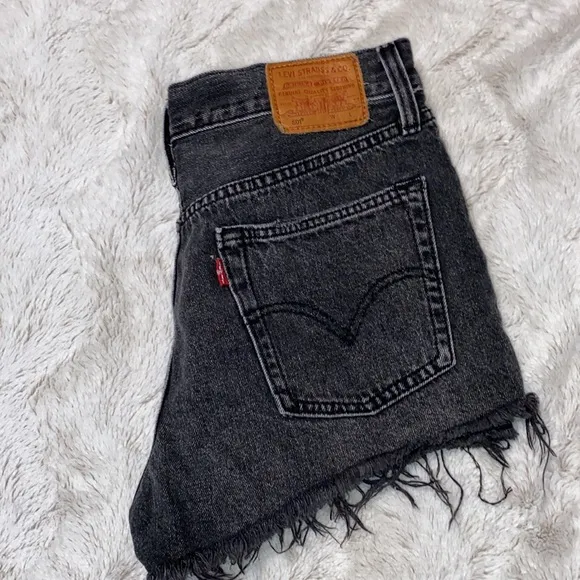 Levi’s 501  distressed black shorts in excellent preowned condition size 27