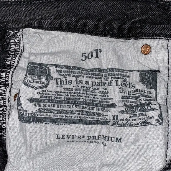Levi’s 501  distressed black shorts in excellent preowned condition size 27