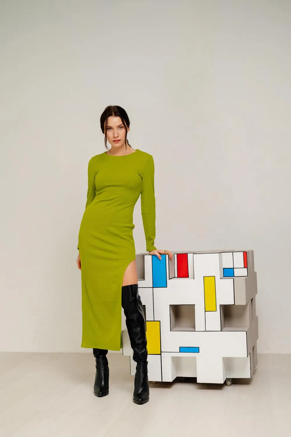 Midi dress with a graceful cutout on the left in olive color
